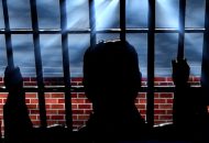silhouette derrière barreaux de prison